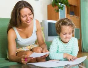 mom reviewing insurance information for dental care