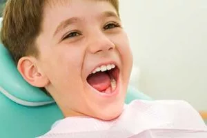 kid smiling at the dentist