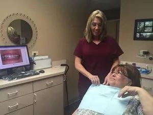 dentist reviewing dental images with patient at Center for Cosmetic Dentistry