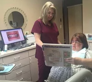 dentist discussing periodontal disease with a patient at Center for Cosmetic Dentistry